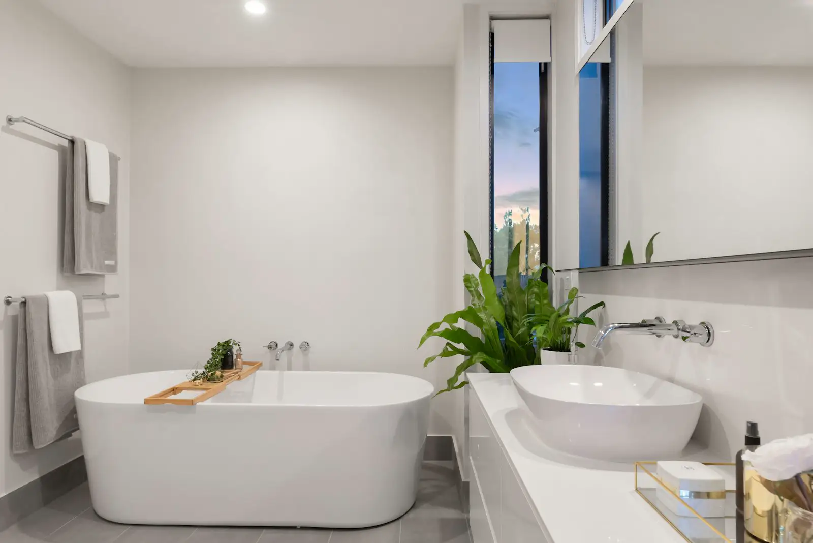 A bathroom with a freestanding tub and a vessel sink. Shown on the Full bathroom page for Reno, NV.